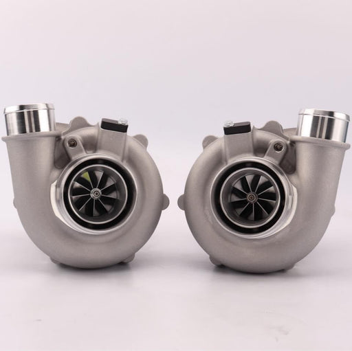 A pair of Pulsar Turbos branded turbochargers with a silver finish, showcasing the compressor and turbine sides.