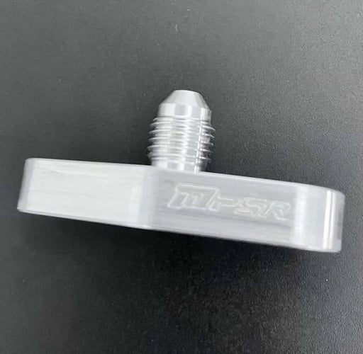 An image showing a silver oil feed flange with an integrated -4 AN port, accompanied by an orange O-ring and two black M8X1.25 bolts on a dark background.
