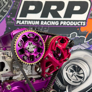 Close-up of purple and red engine components with PRP Platinum Racing Products branding in the background.