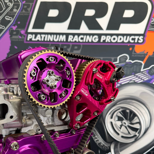 Close-up of purple and red engine components with PRP Platinum Racing Products branding in the background.